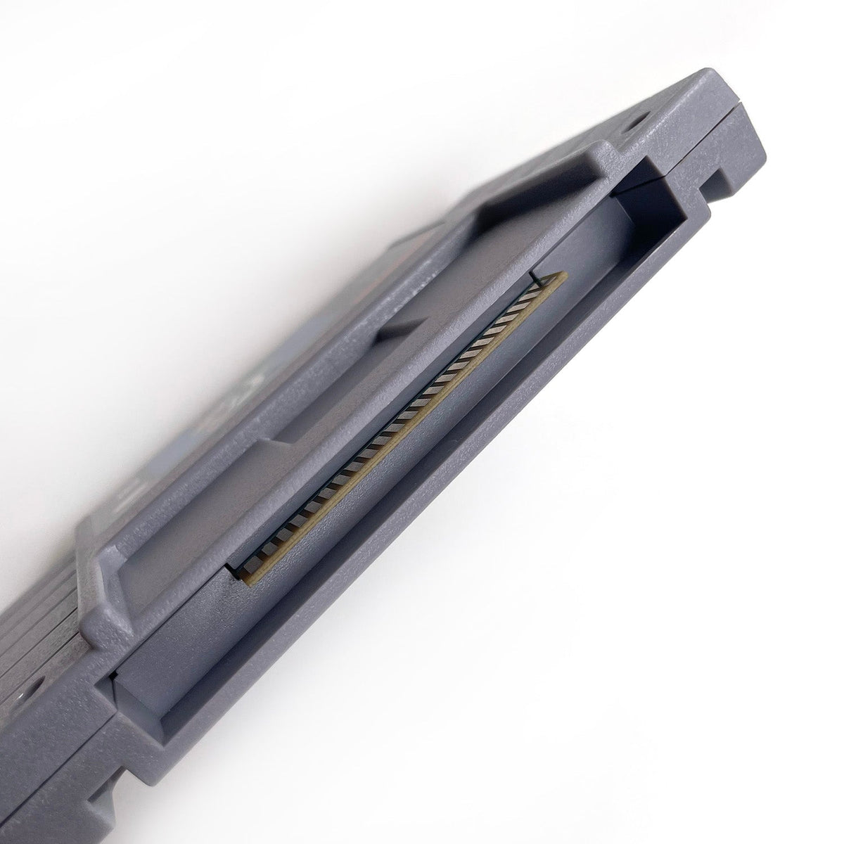 Side view of Chrono Trigger SNES cartridge shell.