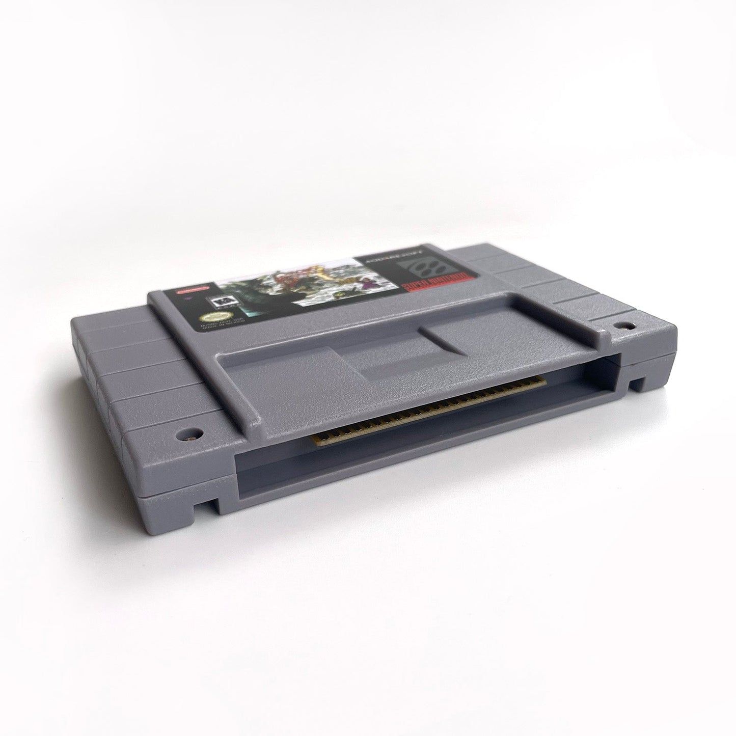 Bottom angled view of Chrono Trigger SNES cartridge.