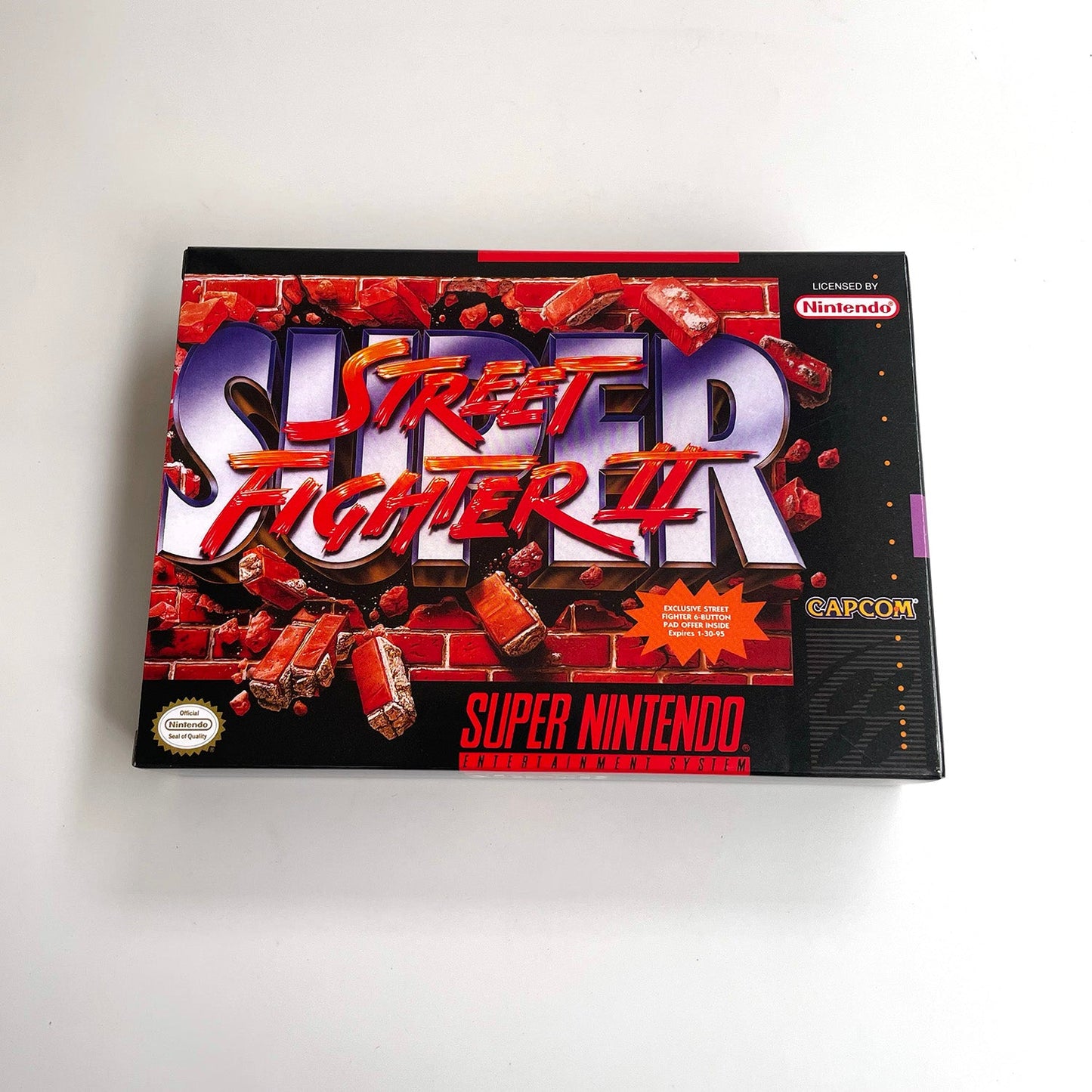 Front view of Super Street Fighter II: The New Challengers SNES box artwork.