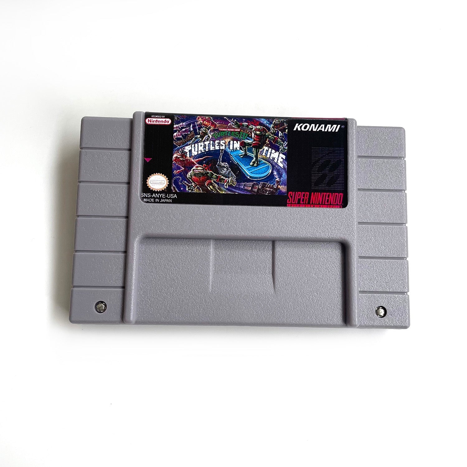Front view of Teenage Mutant Ninja Turtles IV: Turtles in Time SNES game cartridge.