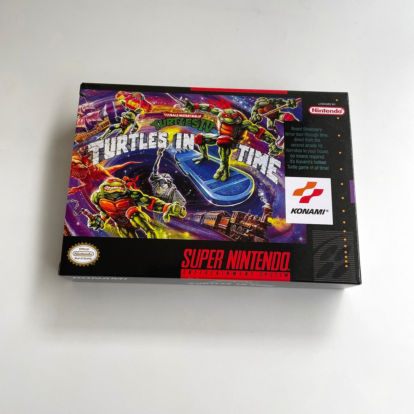 Front view of Teenage Mutant Ninja Turtles IV: Turtles in Time SNES box artwork.